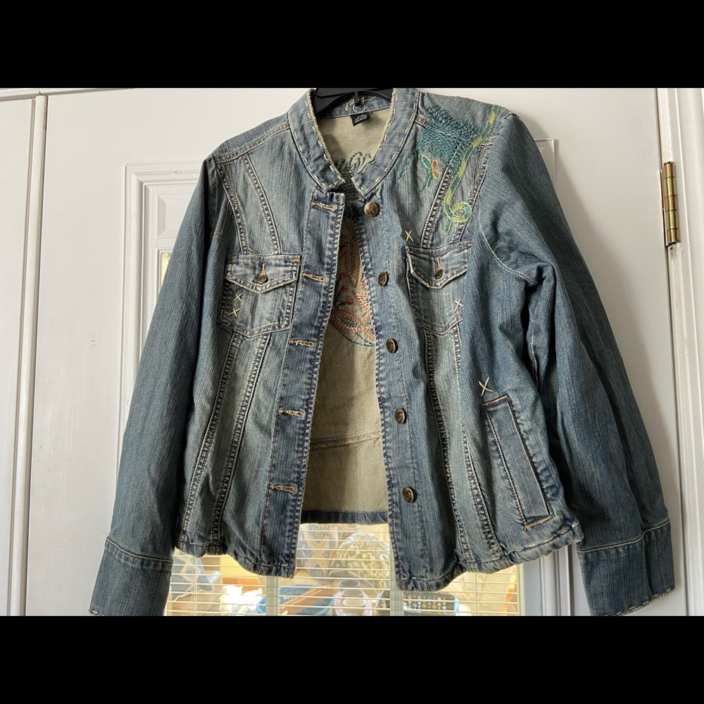 Beautiful embroidered pattern on light denim